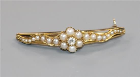 An early-mid 20th century yellow metal, split pearl and diamond demi-lune bar brooch, 46mm.
